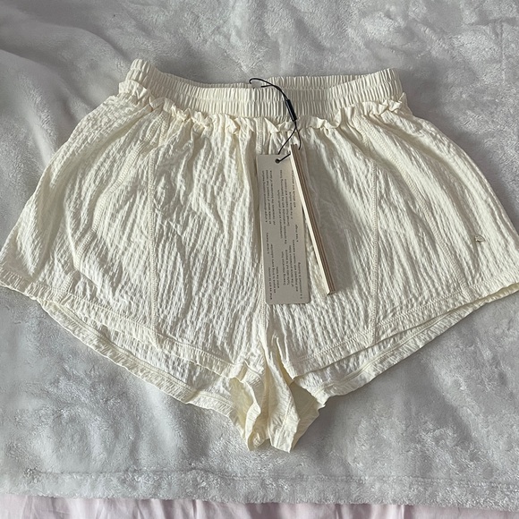 Typha Pants - Typha textured smocked waist dance shorts in cream